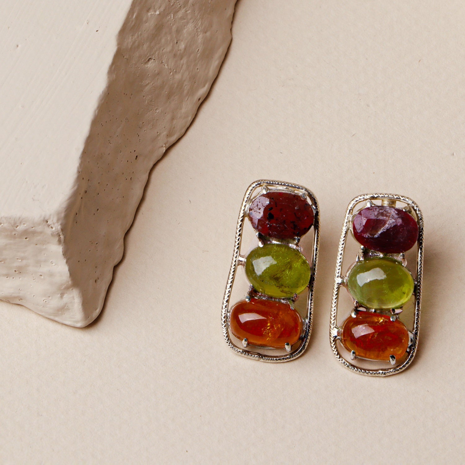 Laurel: A handcrafted Earrings featuring Peridot Ruby and hues of Green Red.