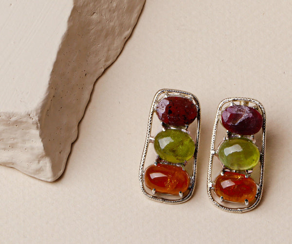 Laurel: A handcrafted Earrings featuring Peridot Ruby and hues of Green Red.