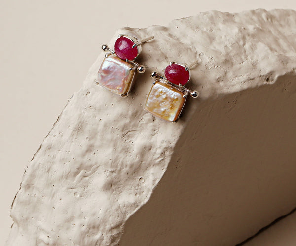 Pomegranate: A handcrafted Earrings featuring nan and hues of nan.
