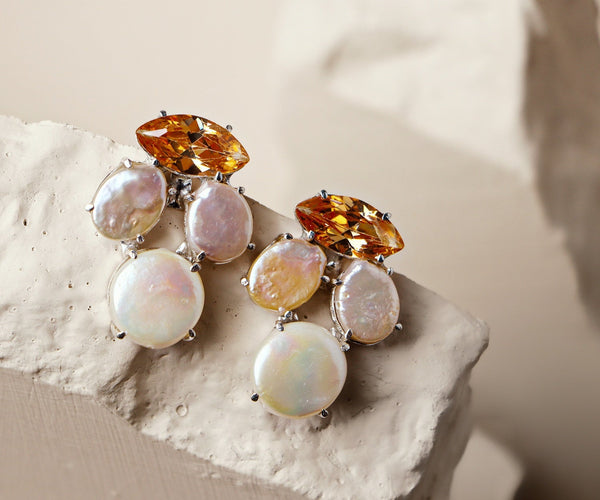 Amaryllis: A handcrafted Earrings featuring nan and hues of nan.