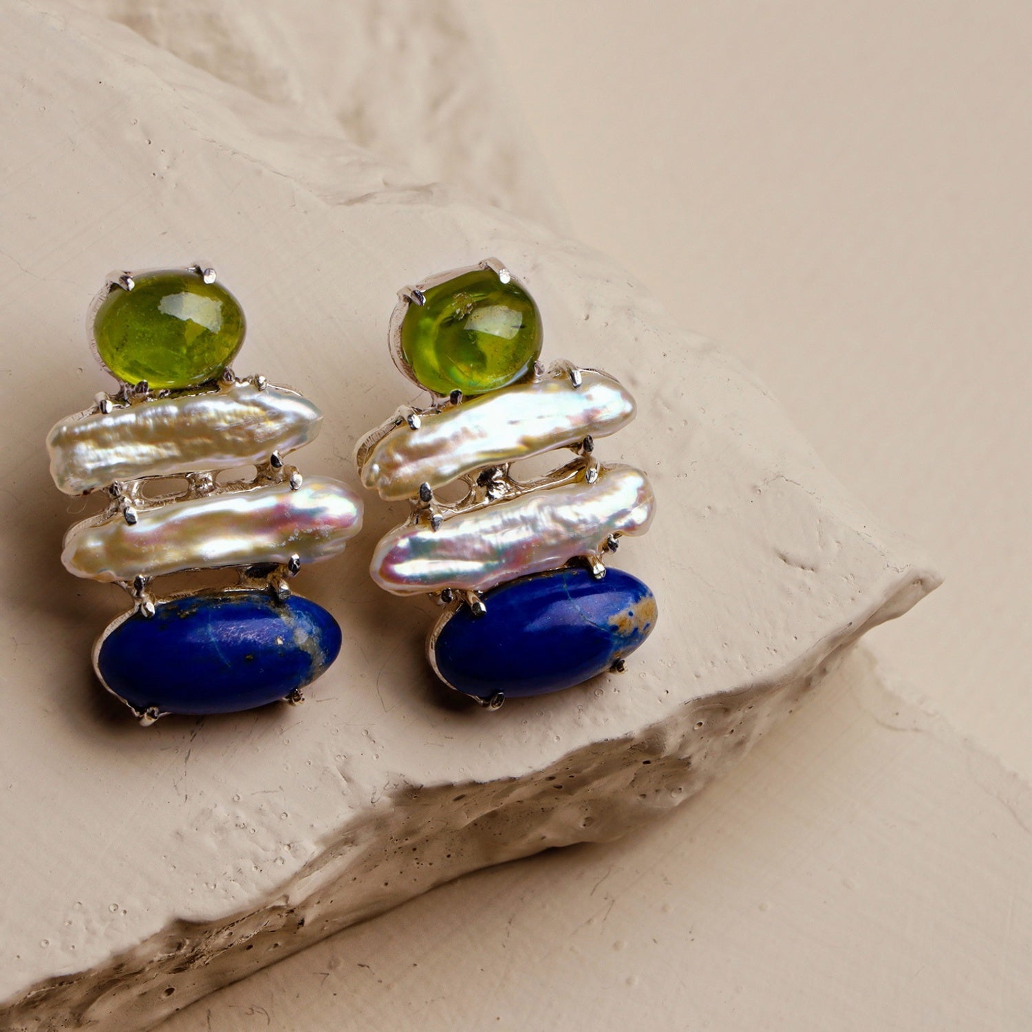 Aster: A handcrafted Earrings featuring nan and hues of nan.