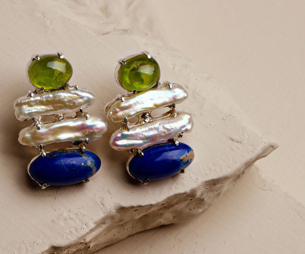 Aster: A handcrafted Earrings featuring nan and hues of nan.