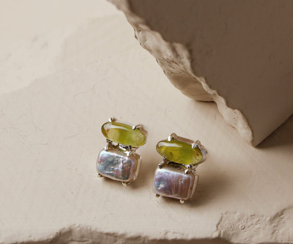 Bea Balm: A handcrafted Earrings featuring nan and hues of nan.