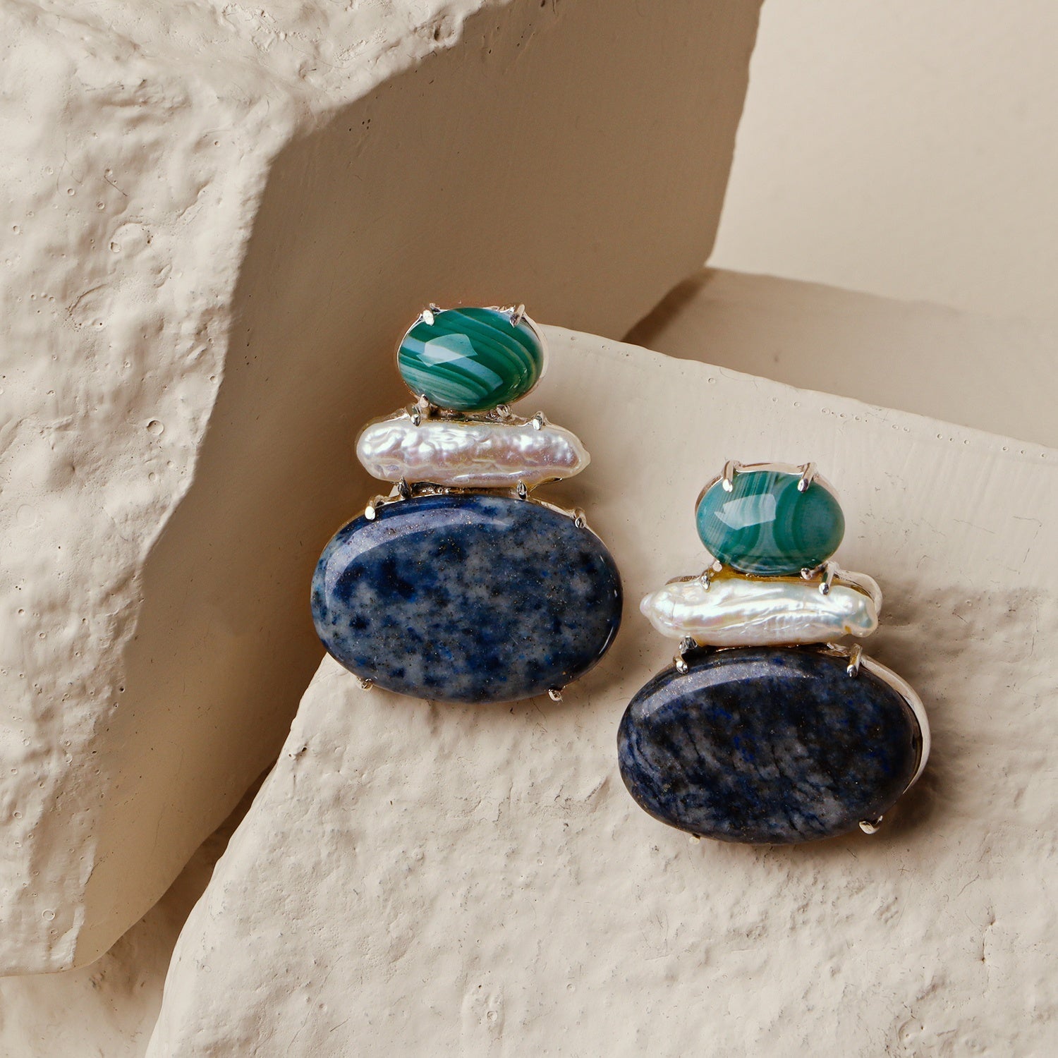 Camellia: A handcrafted Earrings featuring nan and hues of nan.