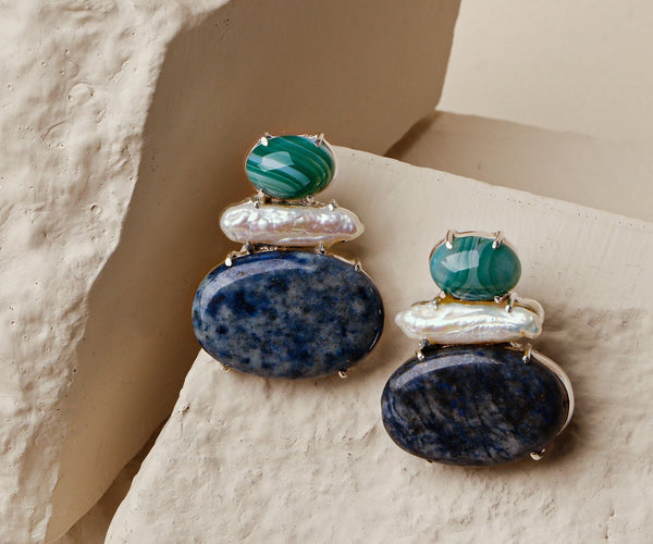 Camellia: A handcrafted Earrings featuring nan and hues of nan.
