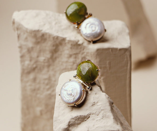 Canna Lily: A handcrafted Earrings featuring nan and hues of nan.