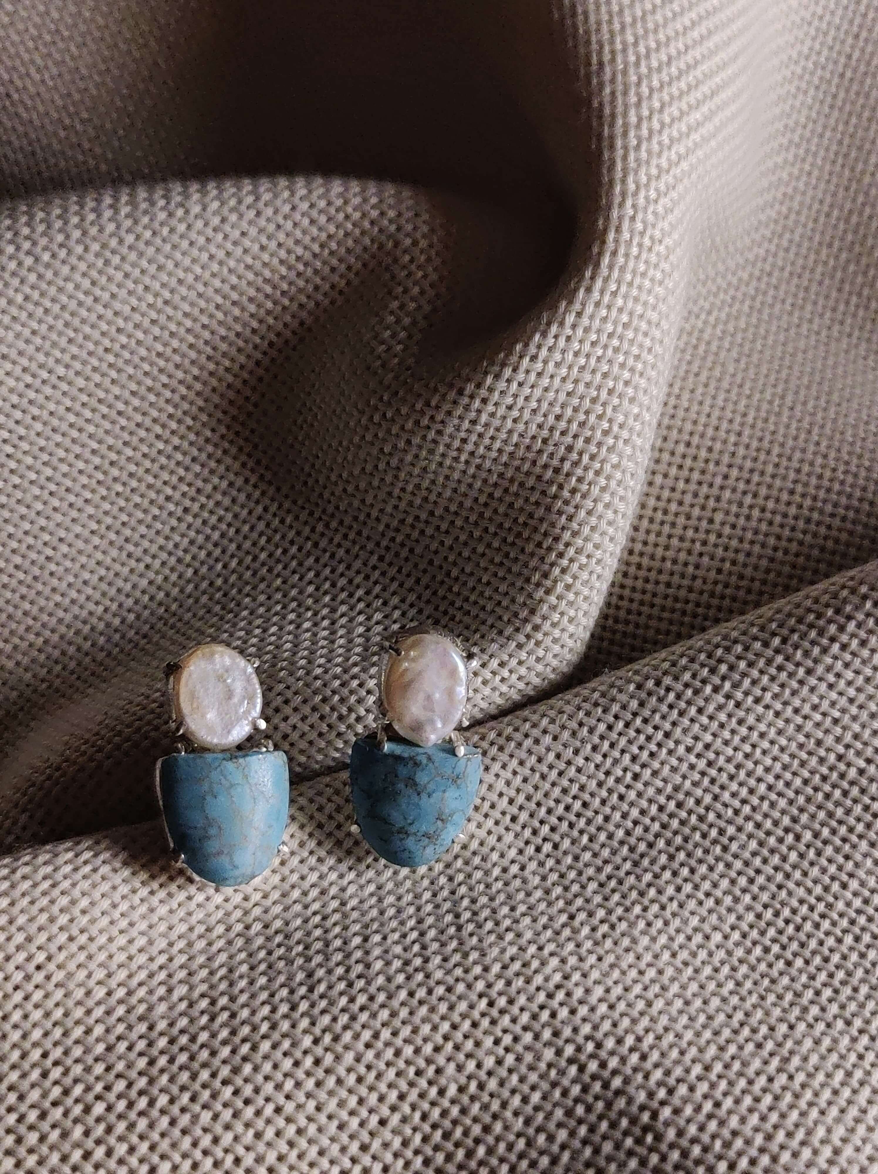 Datura: A handcrafted Earrings featuring Pearl Turquoise and hues of White Blue.