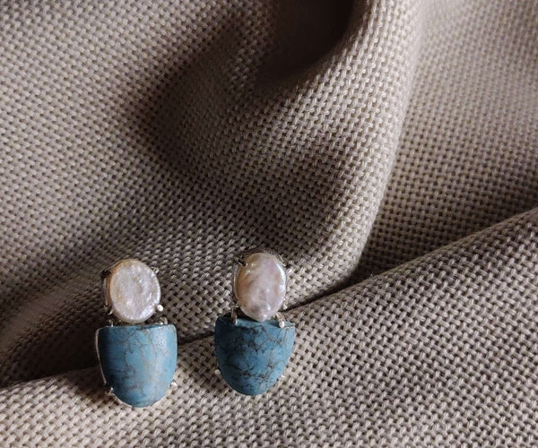 Datura: A handcrafted Earrings featuring Pearl Turquoise and hues of White Blue.