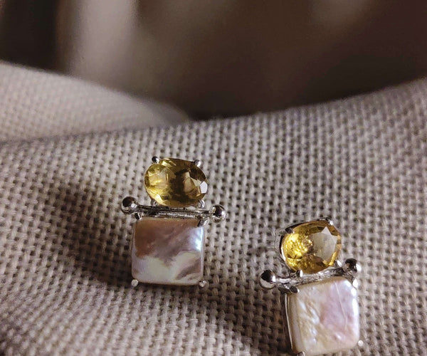 Narcissus: A handcrafted Earrings featuring nan and hues of nan.