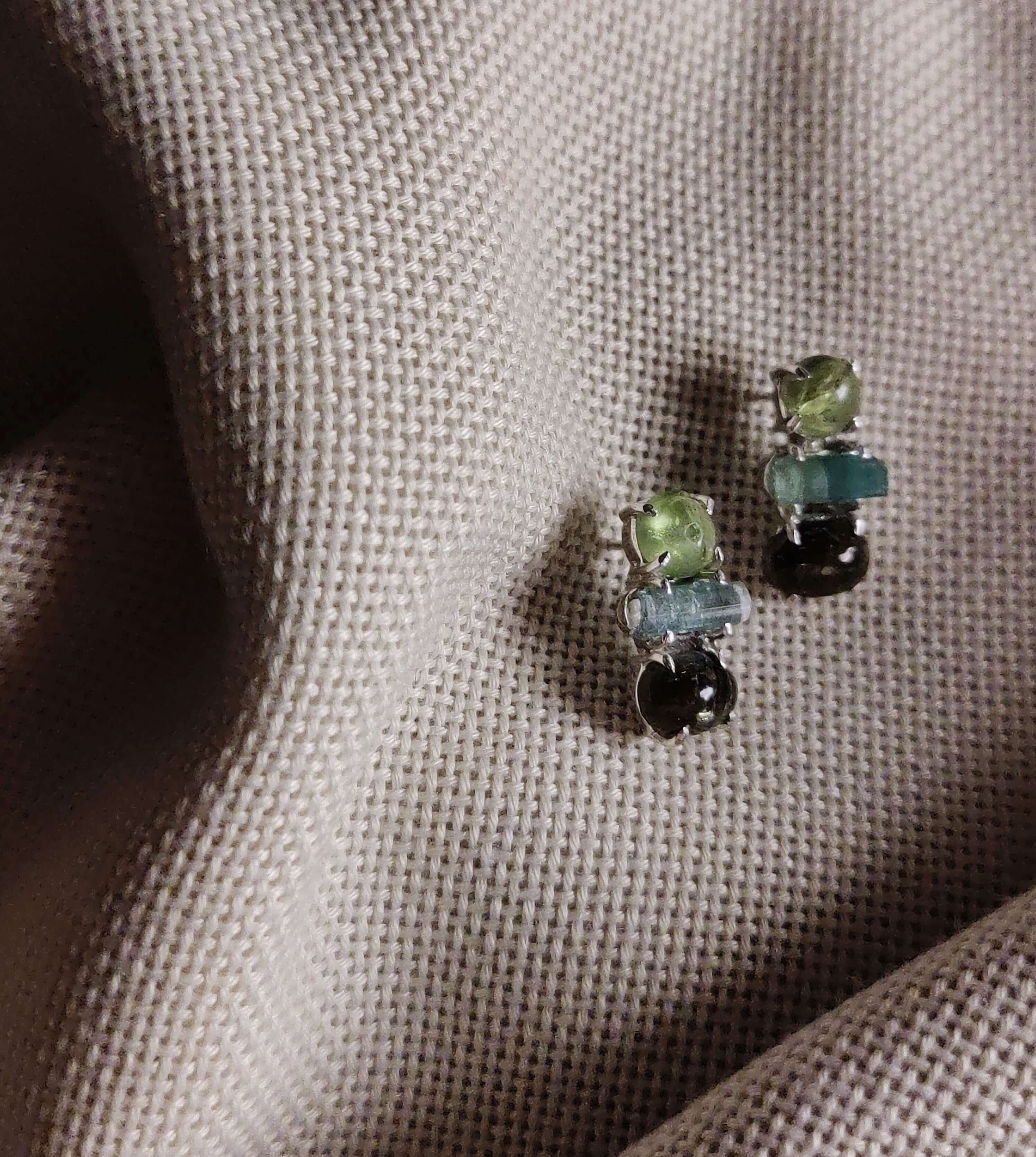 Flax: A handcrafted Earrings featuring Peridot Tourmaline Sapphire and hues of Green.
