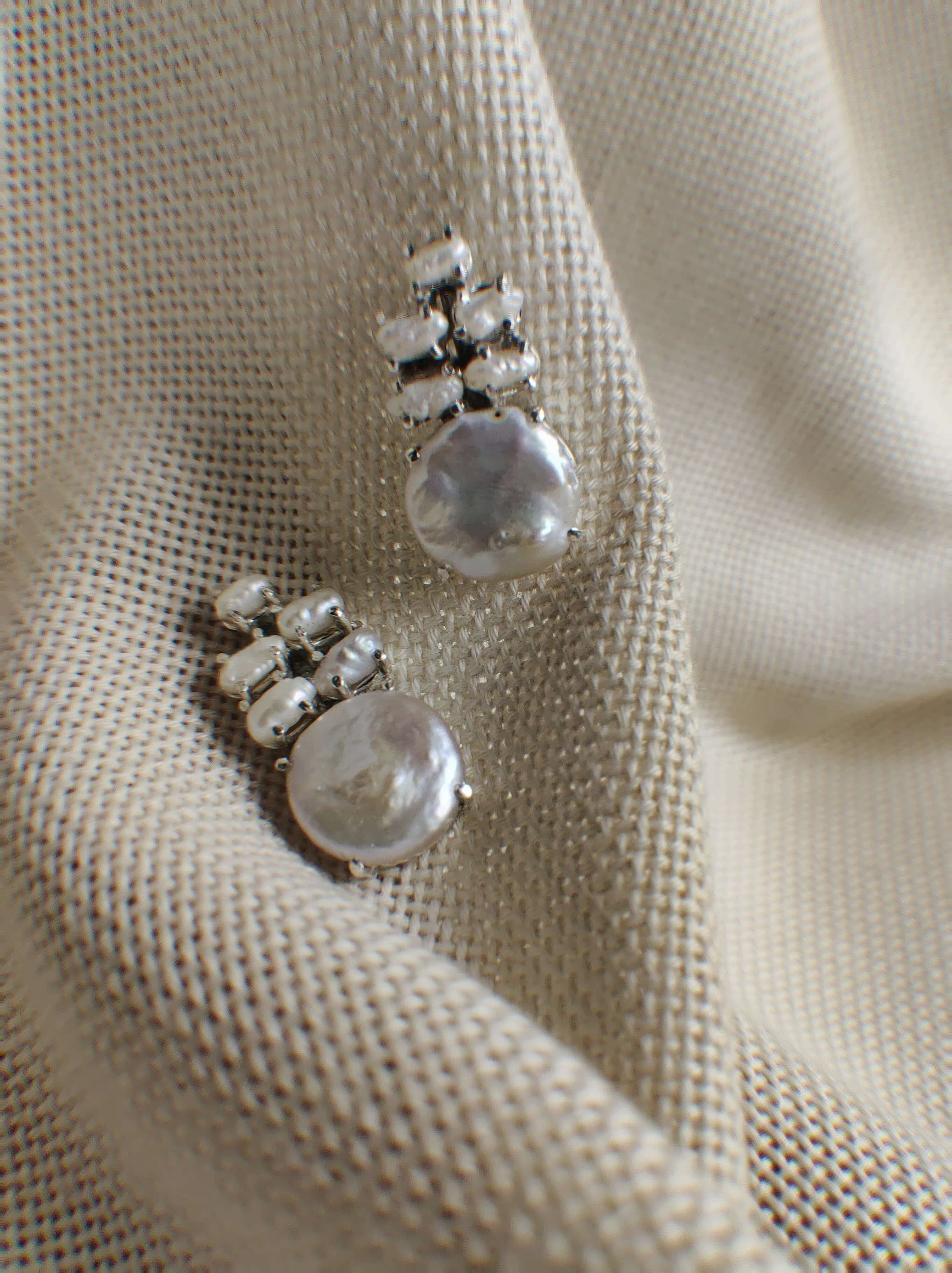 Cosmos: A handcrafted Earrings featuring nan and hues of nan.