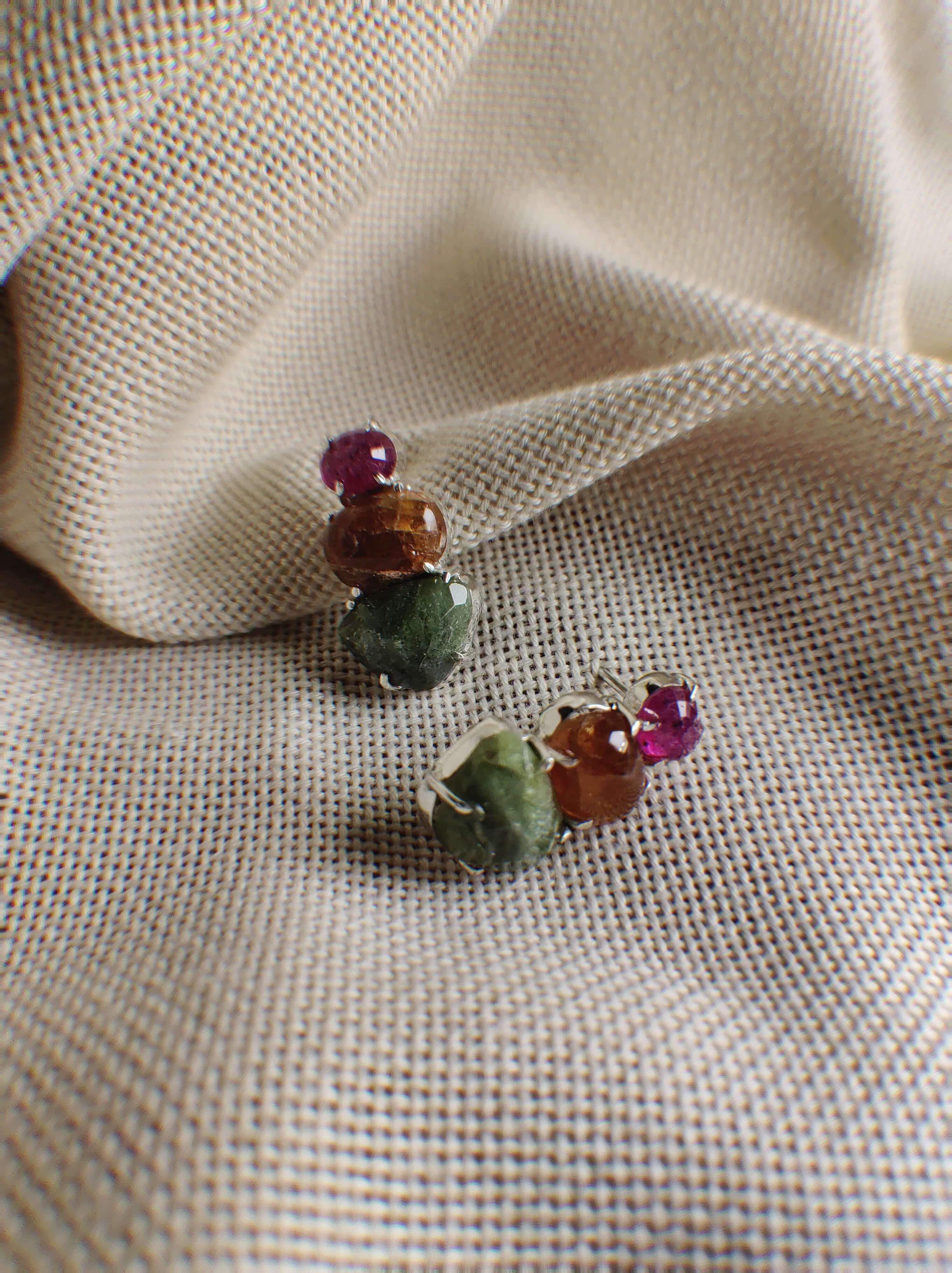 Floristan: A handcrafted Earrings featuring Ruby Peridot Hessonite and hues of Green Red.