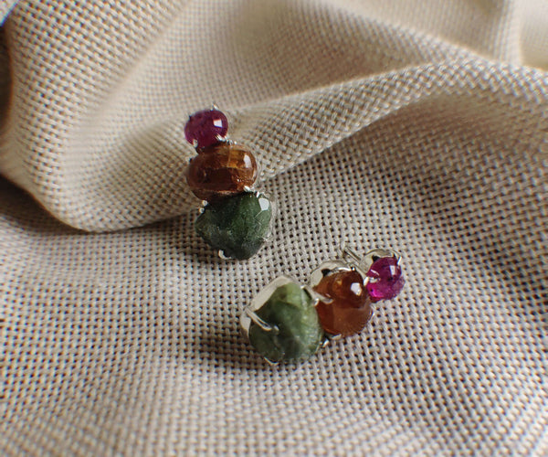 Floristan: A handcrafted Earrings featuring Ruby Peridot Hessonite and hues of Green Red.