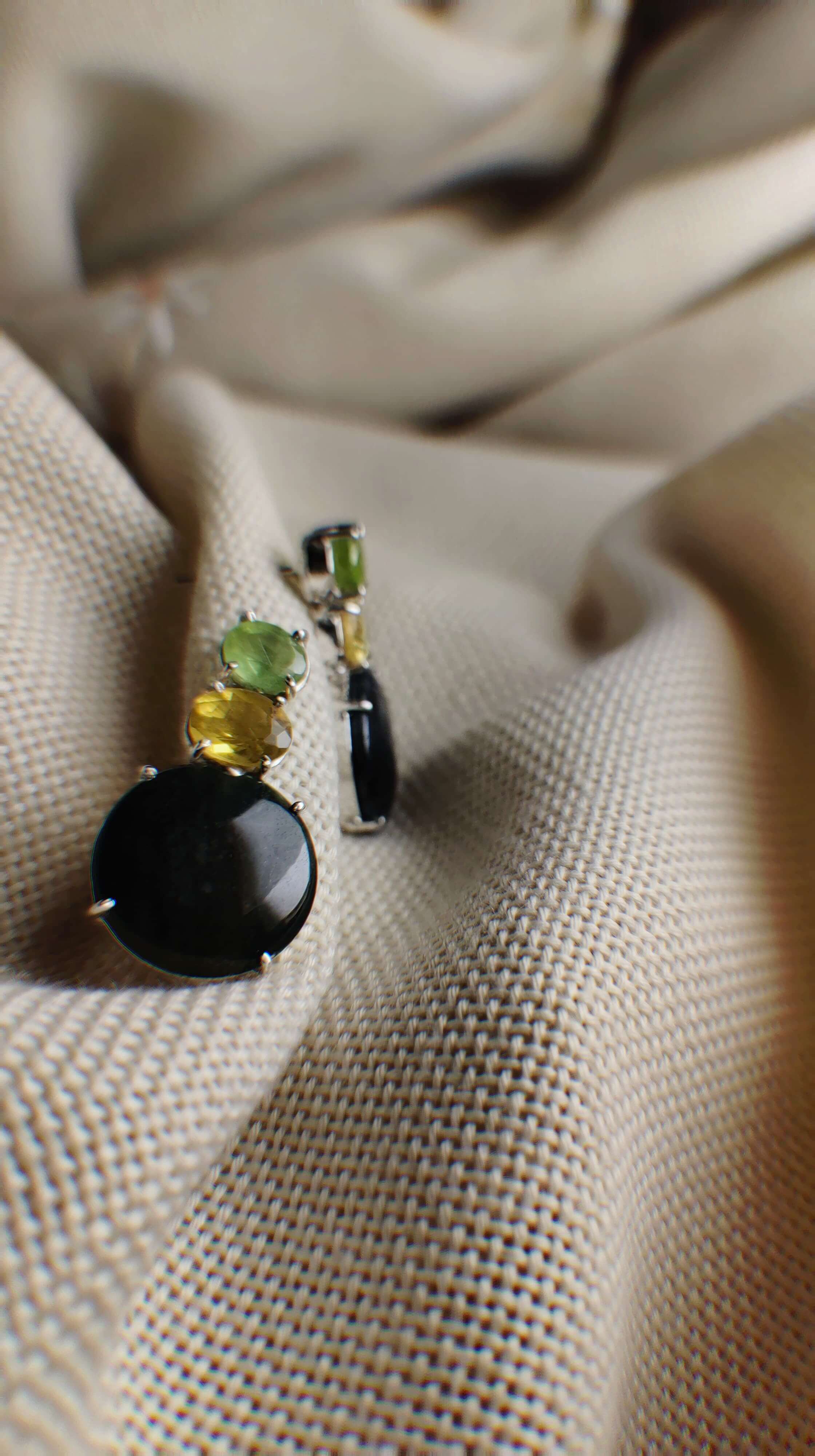 Black Barlow: A handcrafted Earrings featuring nan and hues of nan.