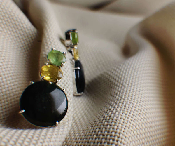 Black Barlow: A handcrafted Earrings featuring nan and hues of nan.