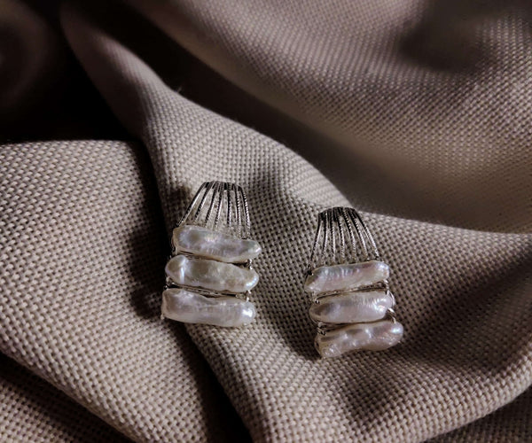 Orchid: A handcrafted Earrings featuring Pearl and hues of White.