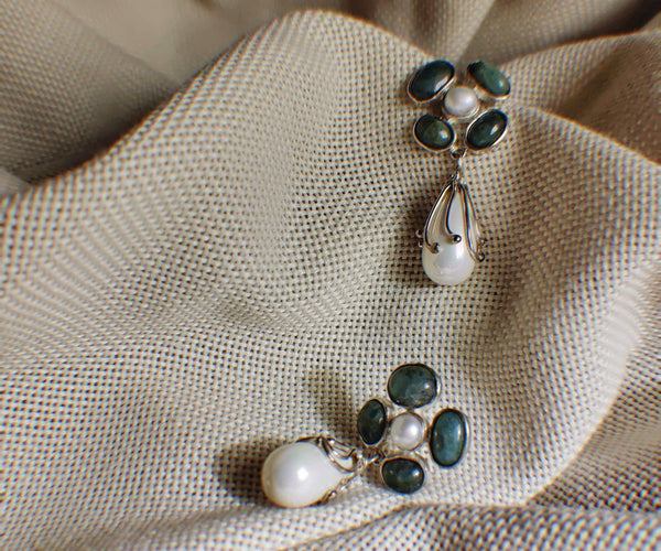 Tuberose: A handcrafted Earrings featuring nan and hues of nan.