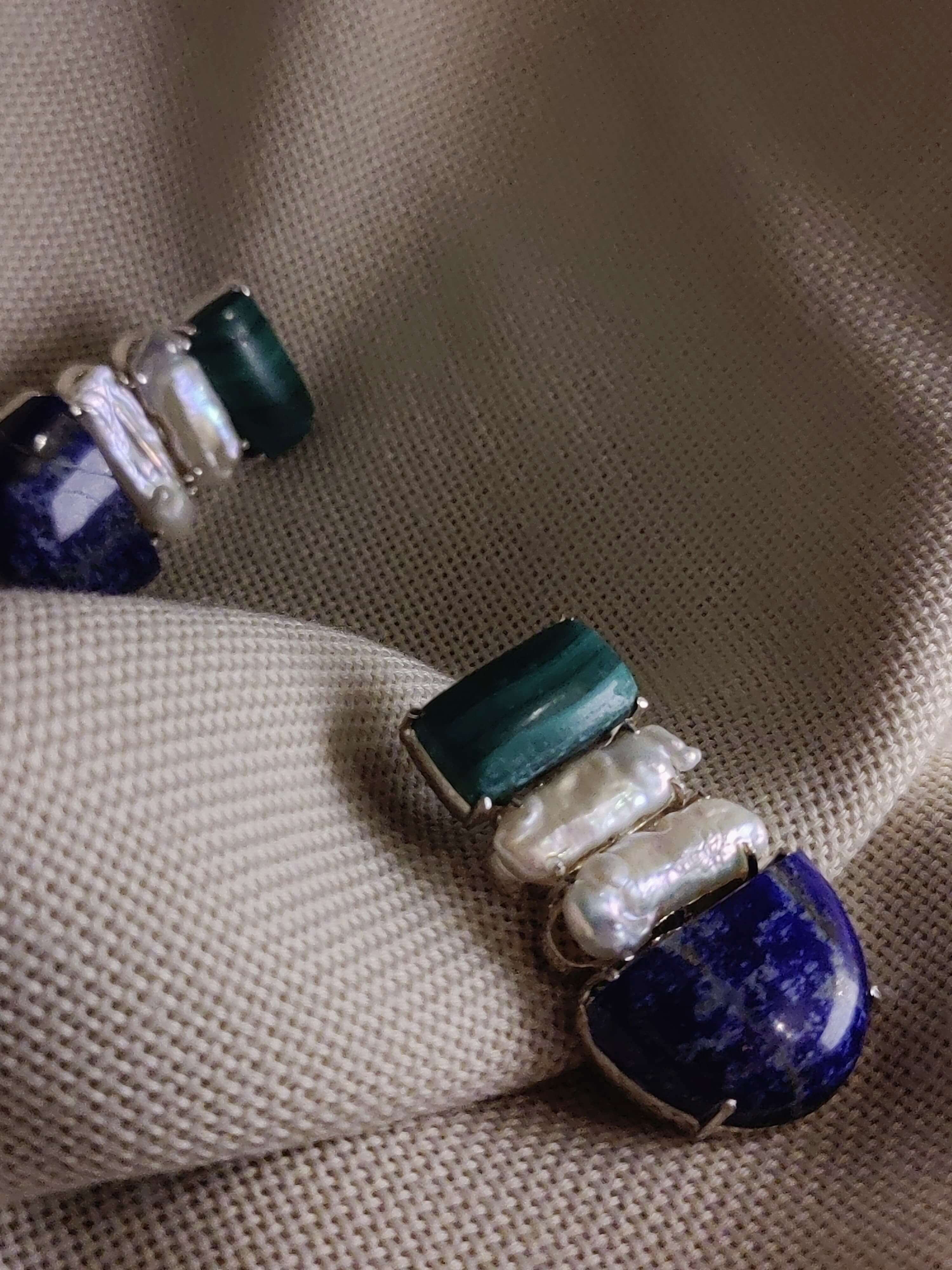 Bletilla: A handcrafted Earrings featuring Malachite Pearl Lapis Lazuli and hues of White Blue.