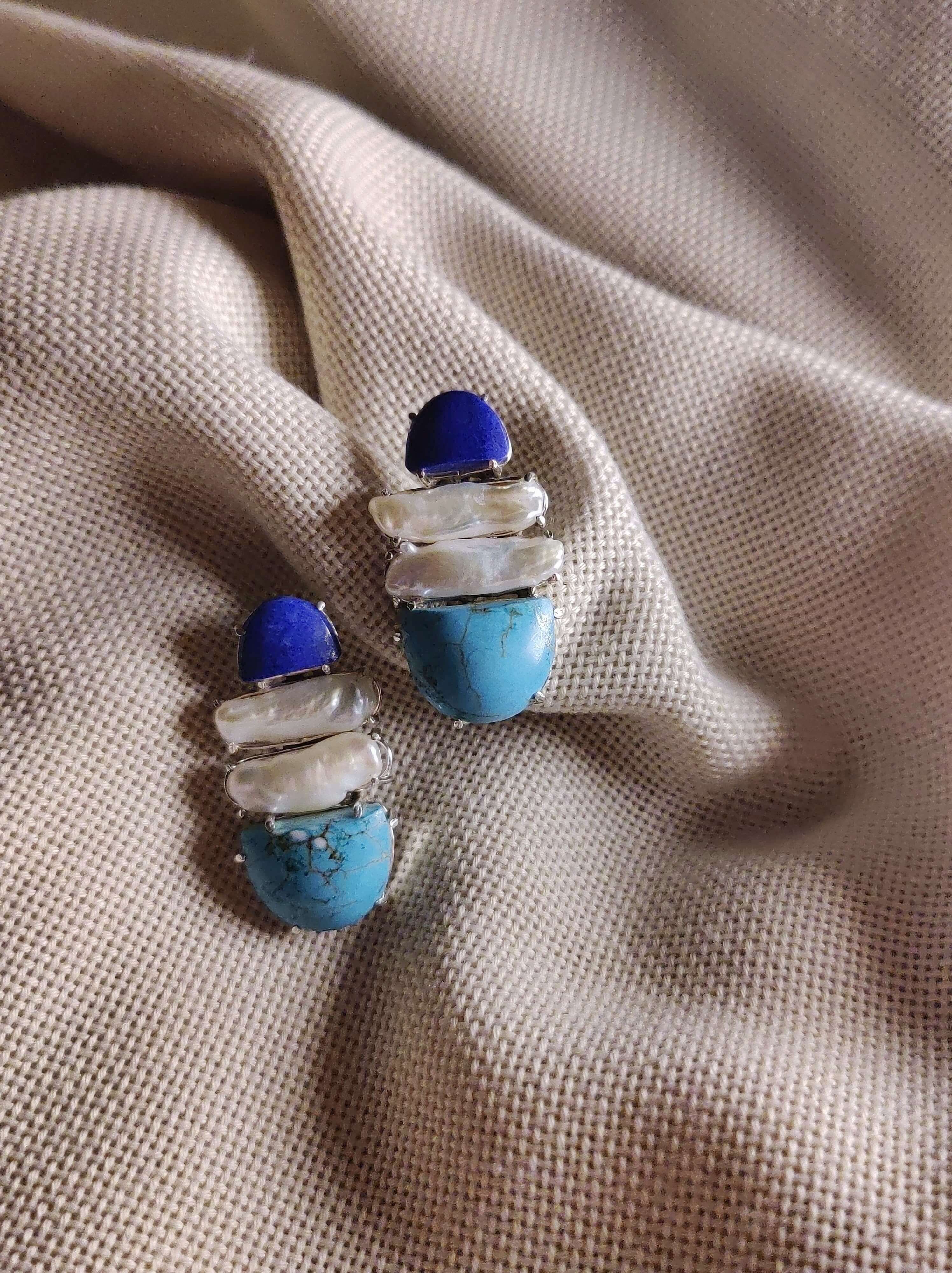 Gerbera: A handcrafted Earrings featuring Lapis Lazuli Pearl Turquoise and hues of White Blue.