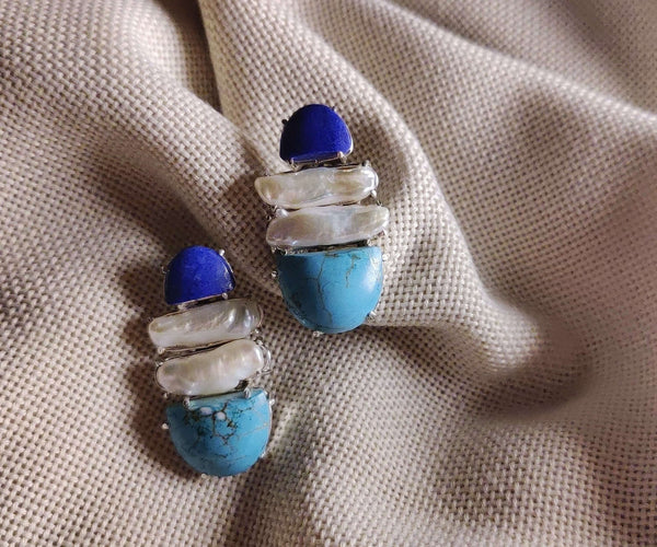 Gerbera: A handcrafted Earrings featuring Lapis Lazuli Pearl Turquoise and hues of White Blue.