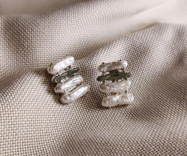 Plumeria: A handcrafted Earrings featuring nan and hues of nan.