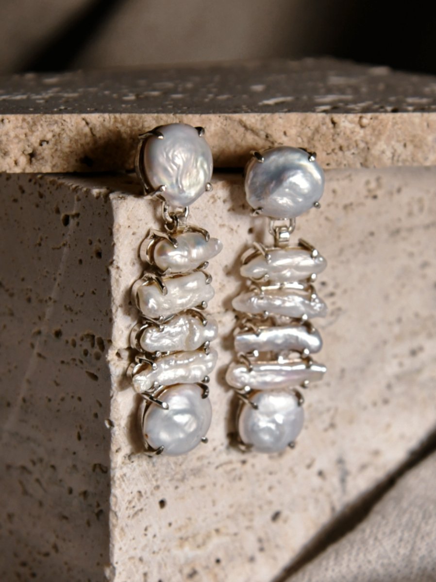 Shirasu: A handcrafted Earrings featuring Pearl and hues of White.