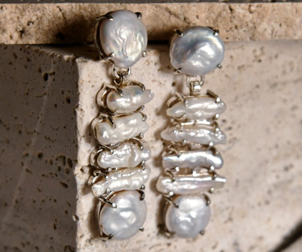 Shirasu: A handcrafted Earrings featuring Pearl and hues of White.