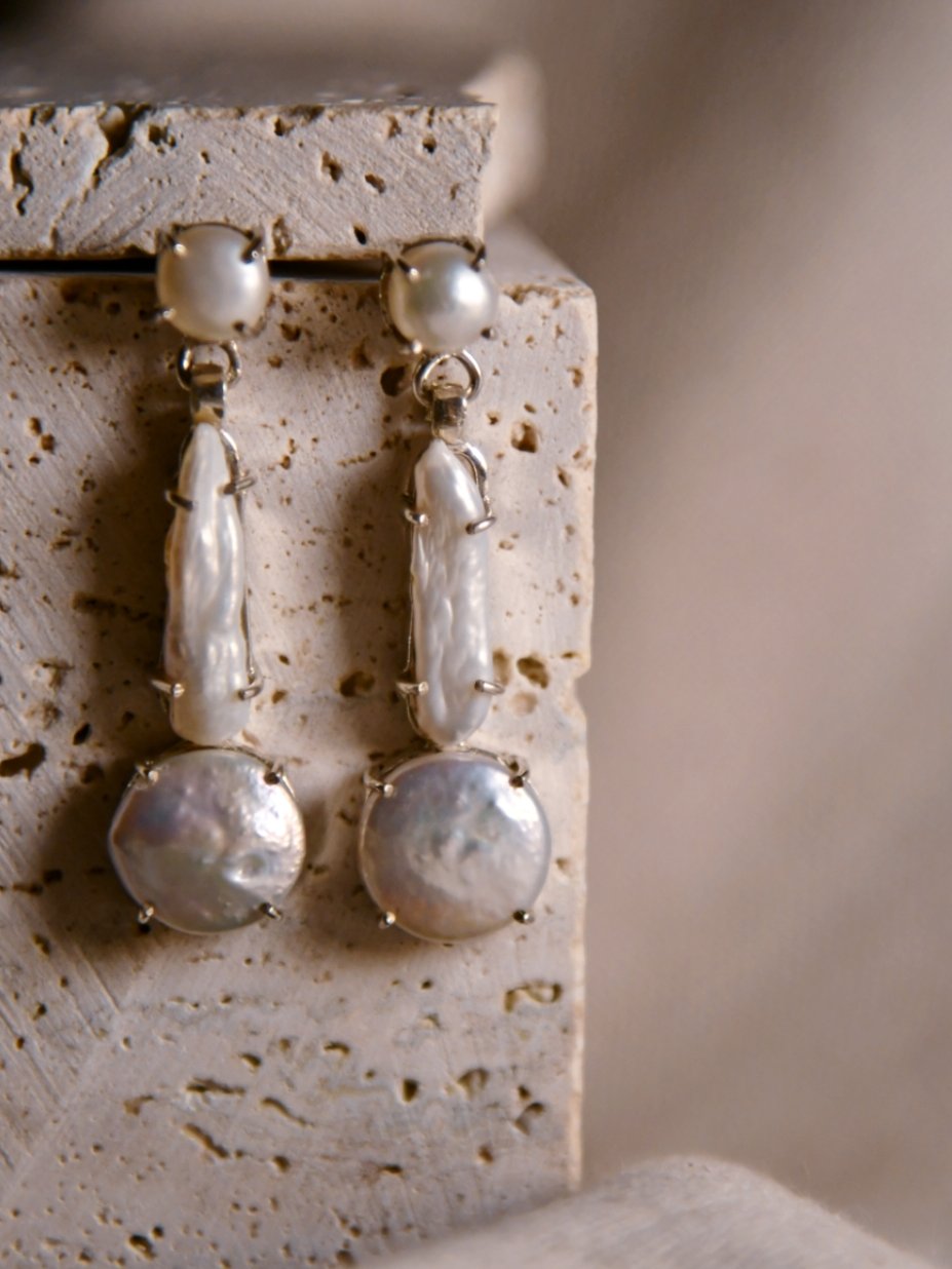 Abeni: A handcrafted Earrings featuring Pearl and hues of White.