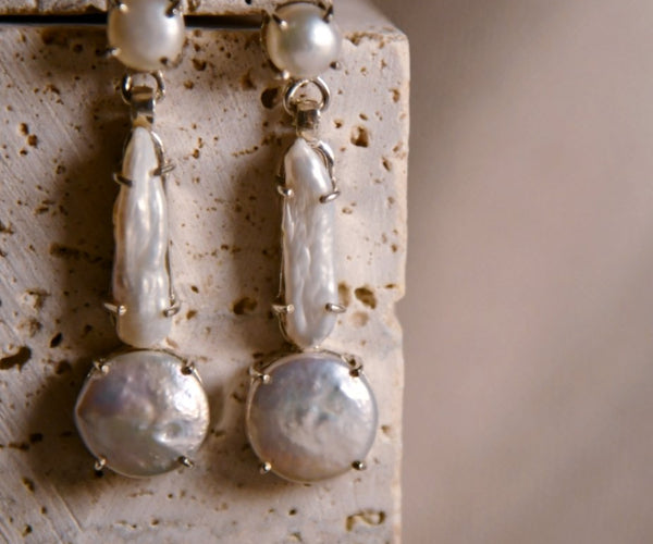 Abeni: A handcrafted Earrings featuring Pearl and hues of White.