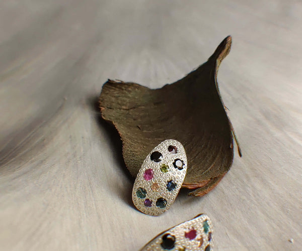 Beetlejuice: A handcrafted Earrings featuring Ruby Citrine Emerald Amethyst and hues of Red Green Yellow Purple.