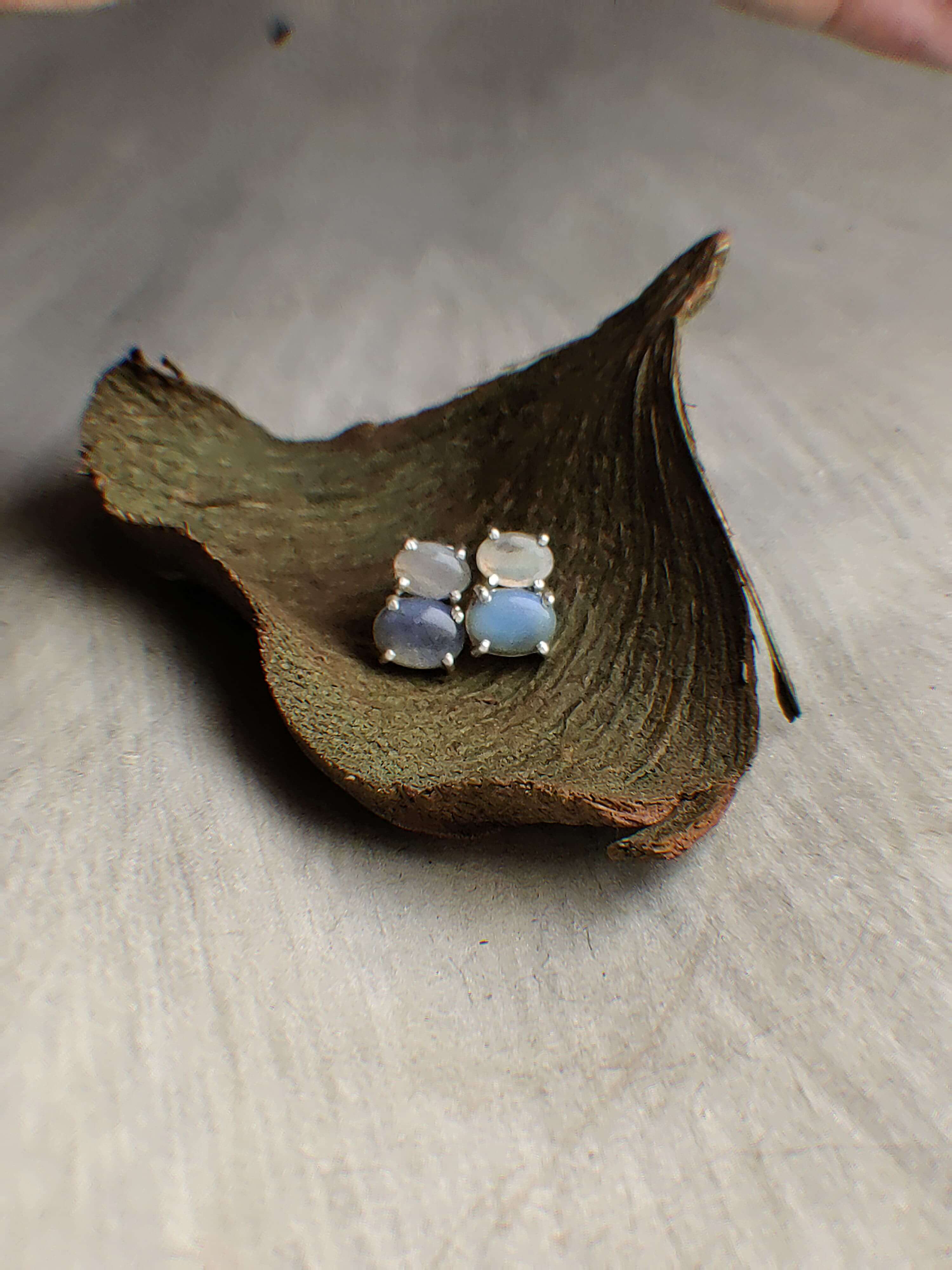 James & Lily: A handcrafted Earrings featuring Opal and hues of White.