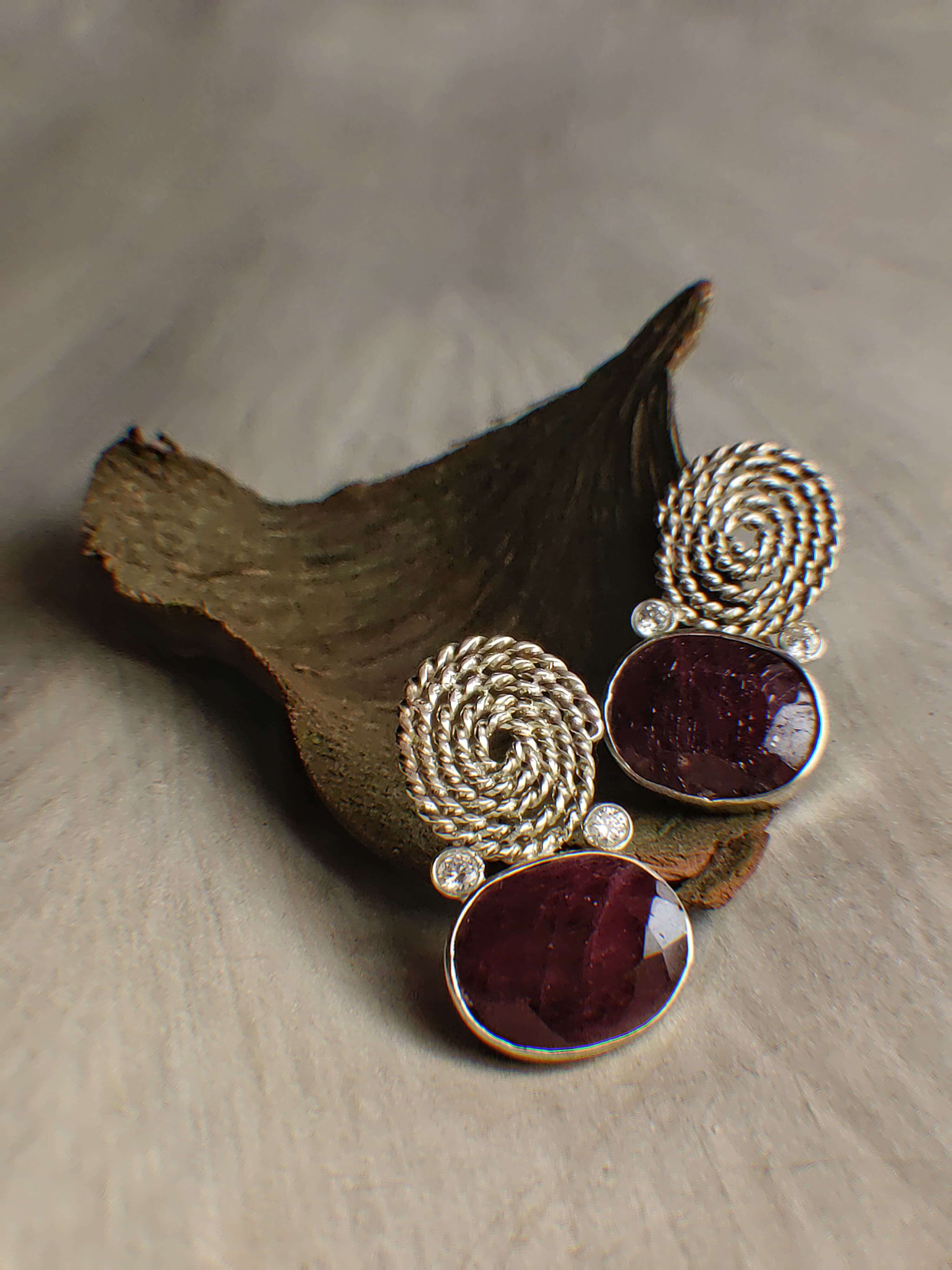 Victoria: A handcrafted Earrings featuring Ruby  Zirconia and hues of White Red.