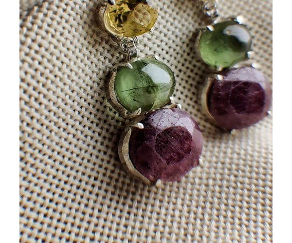 Flitter bloom: A handcrafted Earrings featuring Ruby Citrine Peridot and hues of Red Yellow Green.
