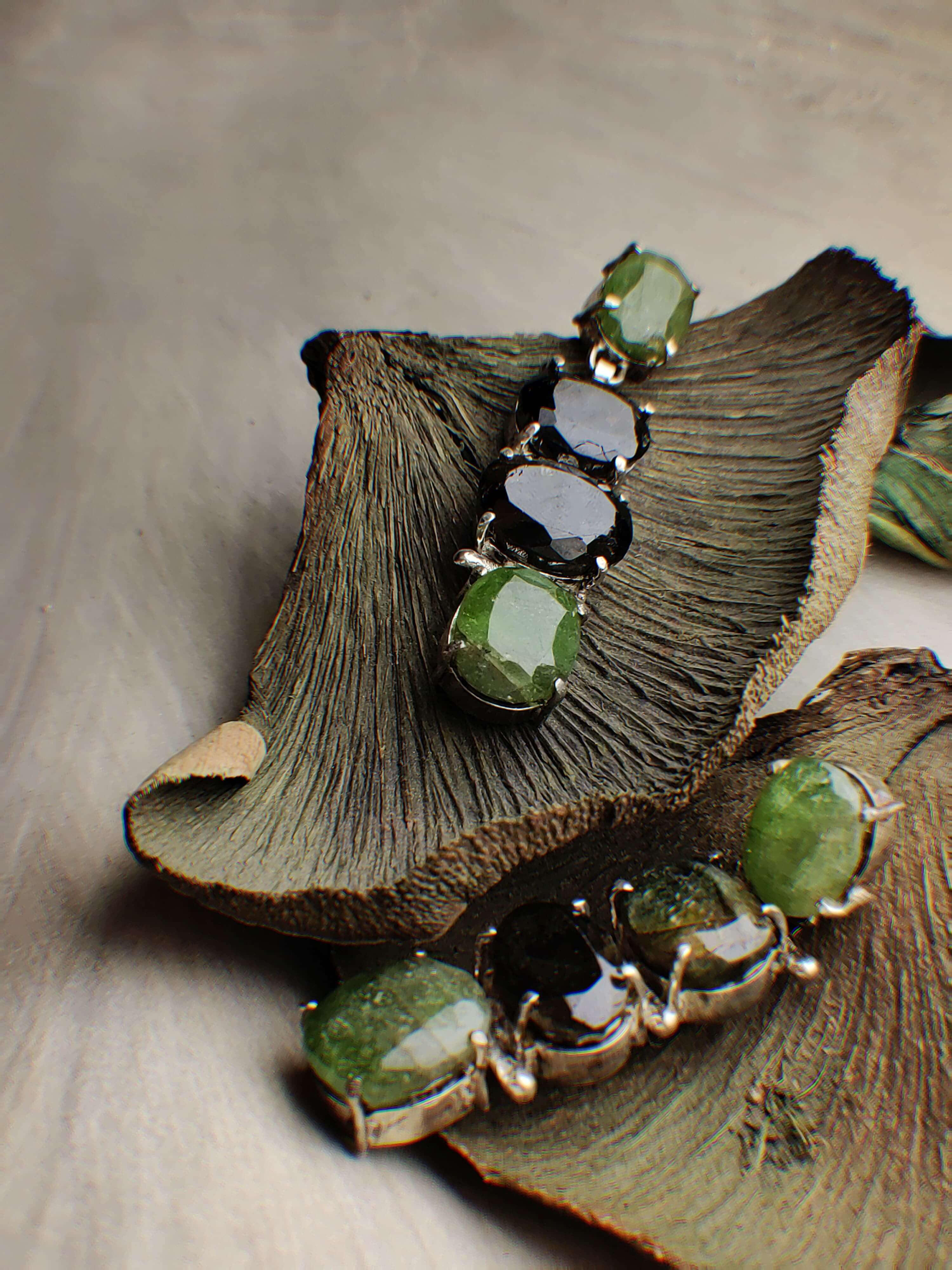 Reed: A handcrafted Earrings featuring Peridot Tourmaline and hues of Green.