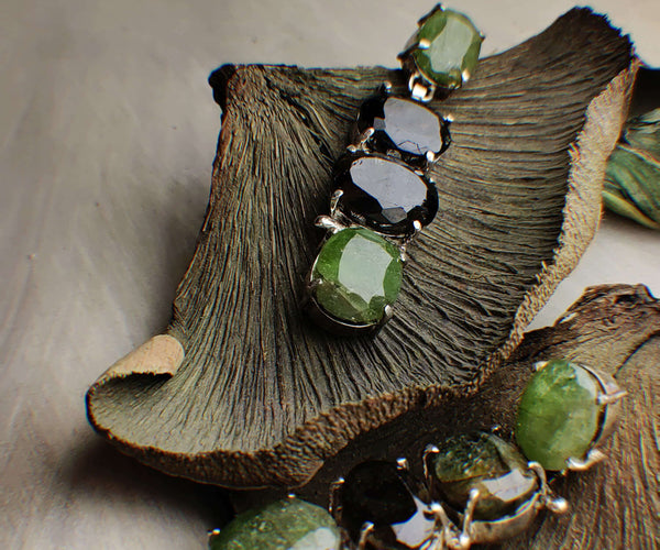 Reed: A handcrafted Earrings featuring Peridot Tourmaline and hues of Green.
