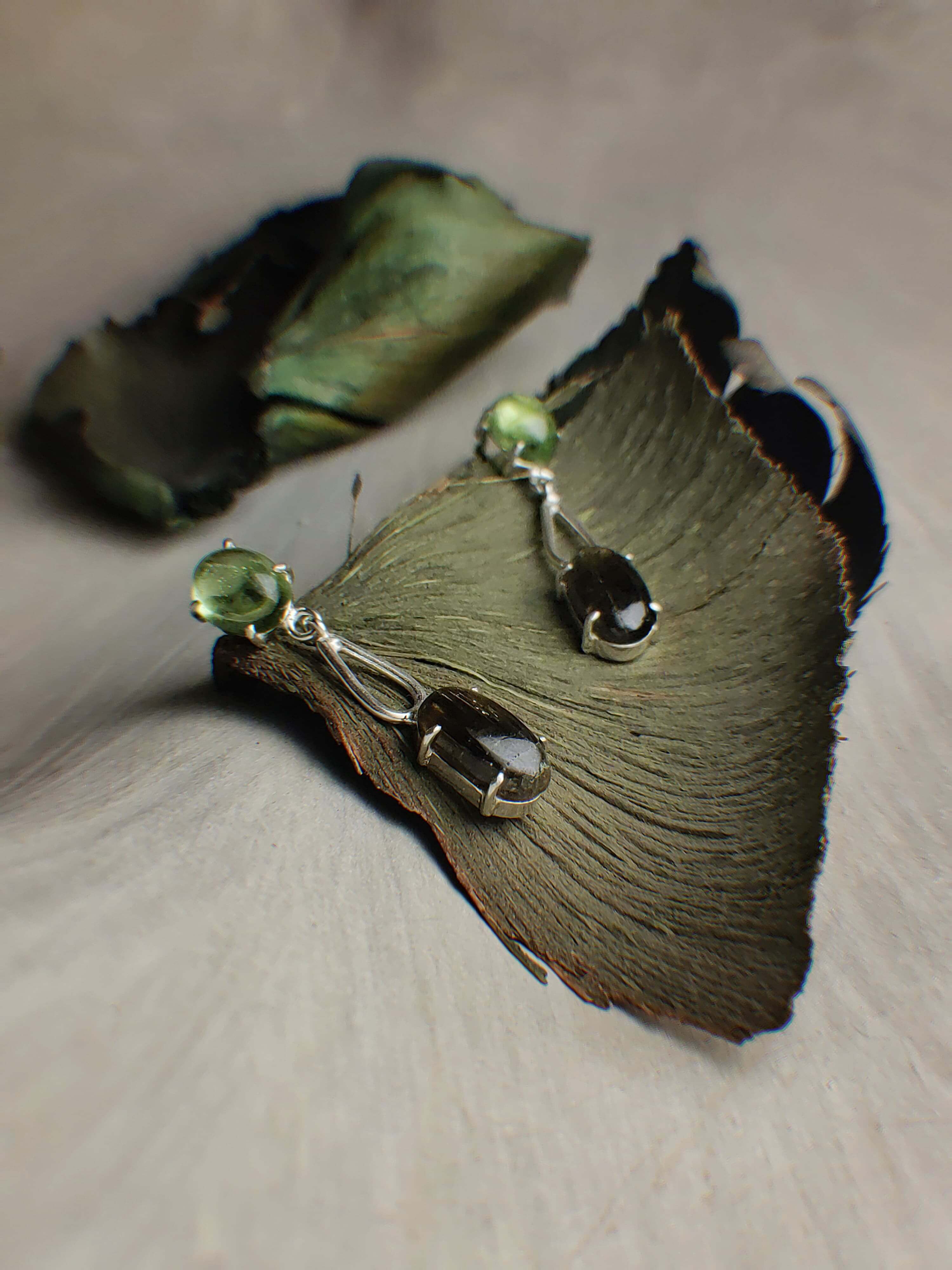 Leaf: A handcrafted Earrings featuring Peridot Tourmaline and hues of Green.