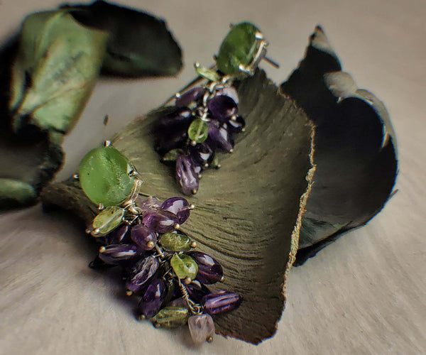 Vines: A handcrafted Earrings featuring Amethyst Peridot and hues of Purple Green.