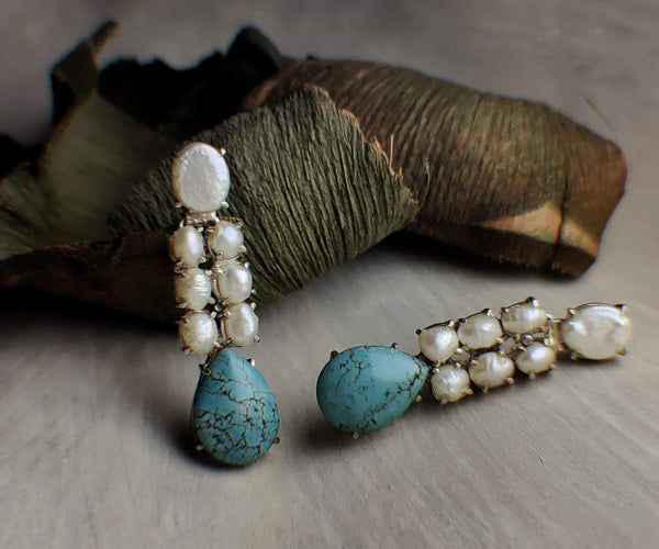 Eva: A handcrafted Earrings featuring Pearl Turquoise and hues of White Blue.