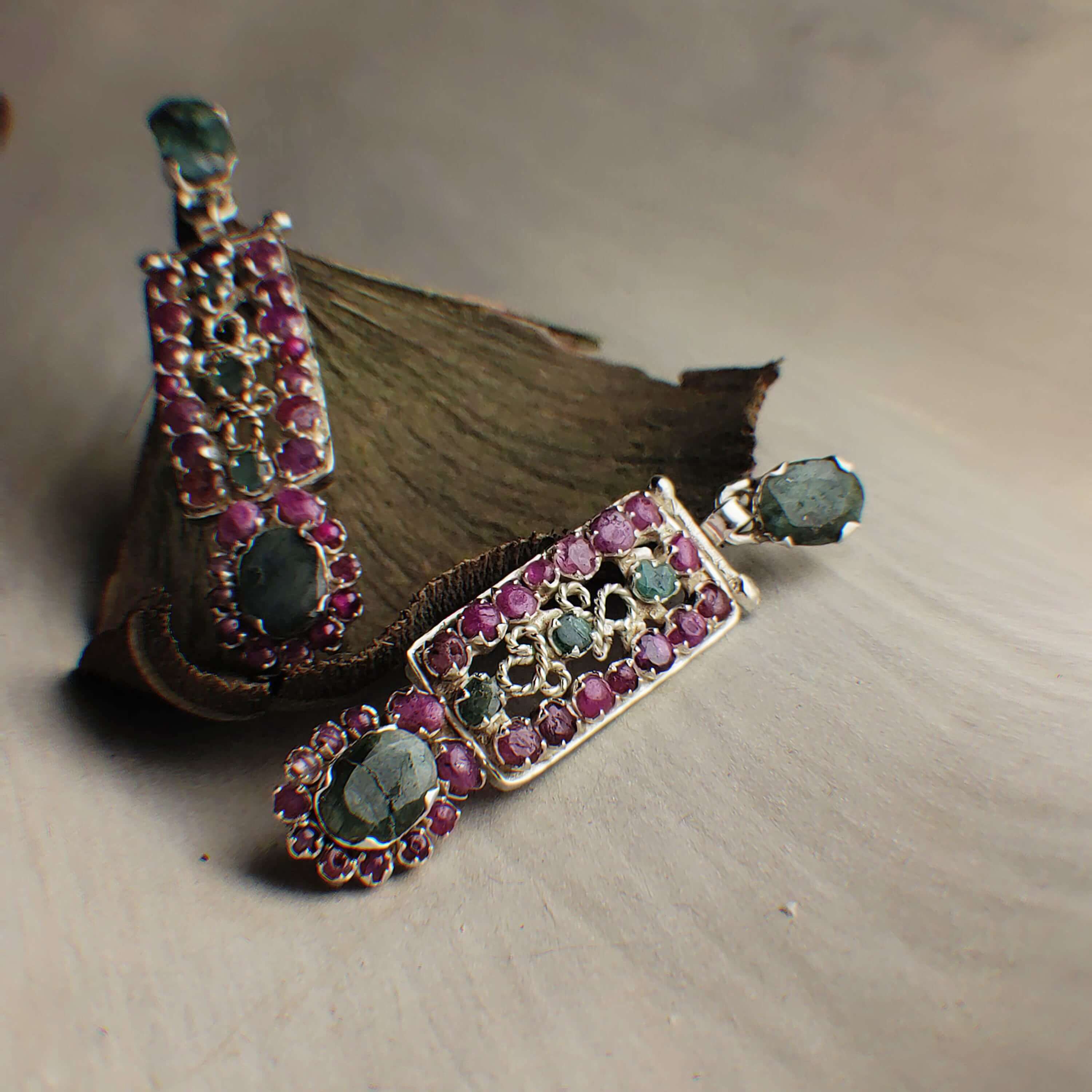 Infinity: A handcrafted Earrings featuring Ruby Emerald and hues of Green Red.