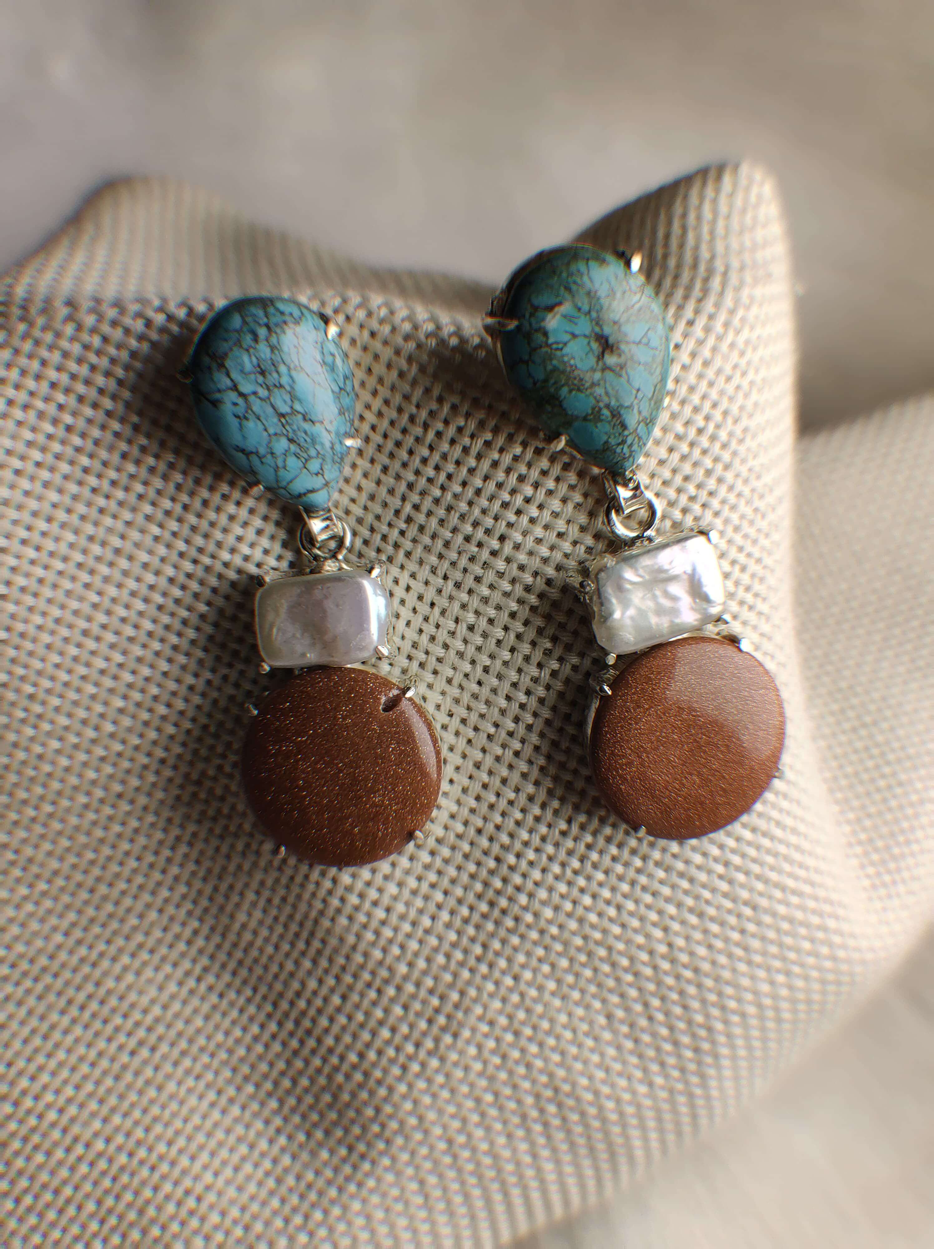 Aether: A handcrafted Earrings featuring Turquoise Pearl Sandstone and hues of Blue White Brown.