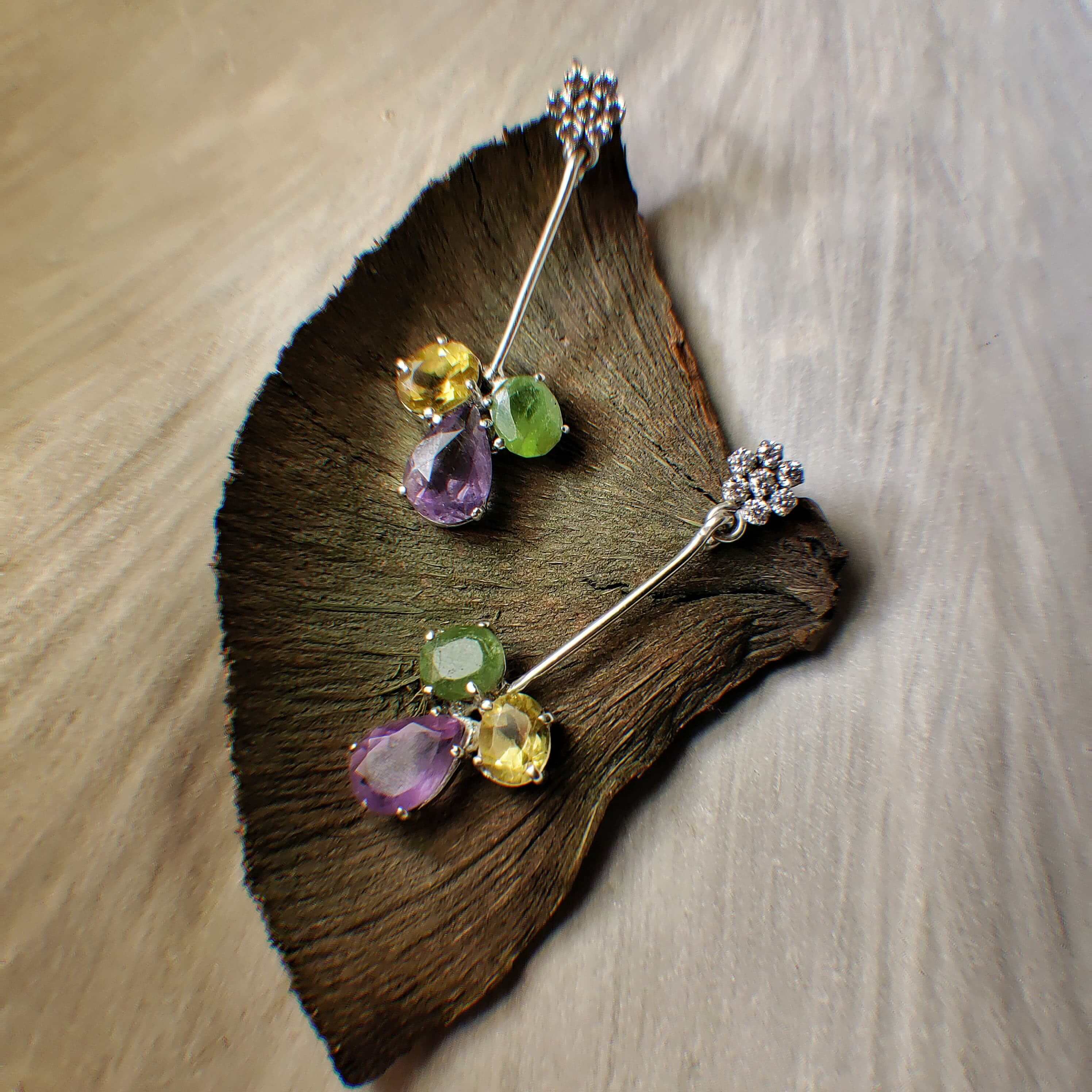 Hope: A handcrafted Earrings featuring Amethyst Citrine Peridot and hues of Purple Green Yellow.
