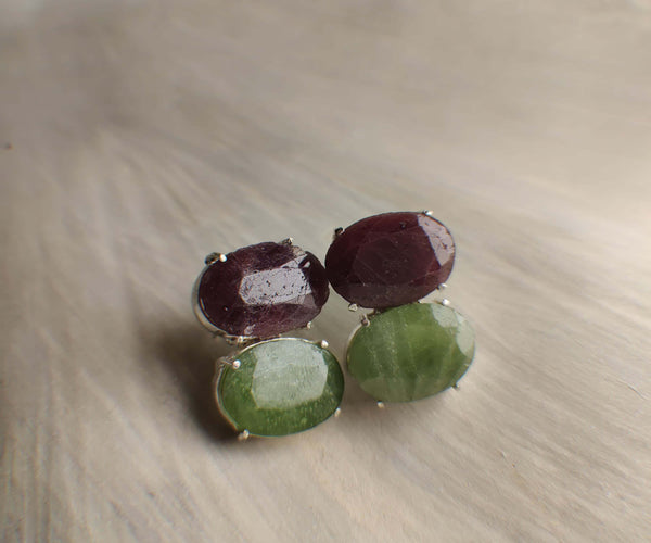 Nox: A handcrafted Earrings featuring Ruby Peridot and hues of Red Green.