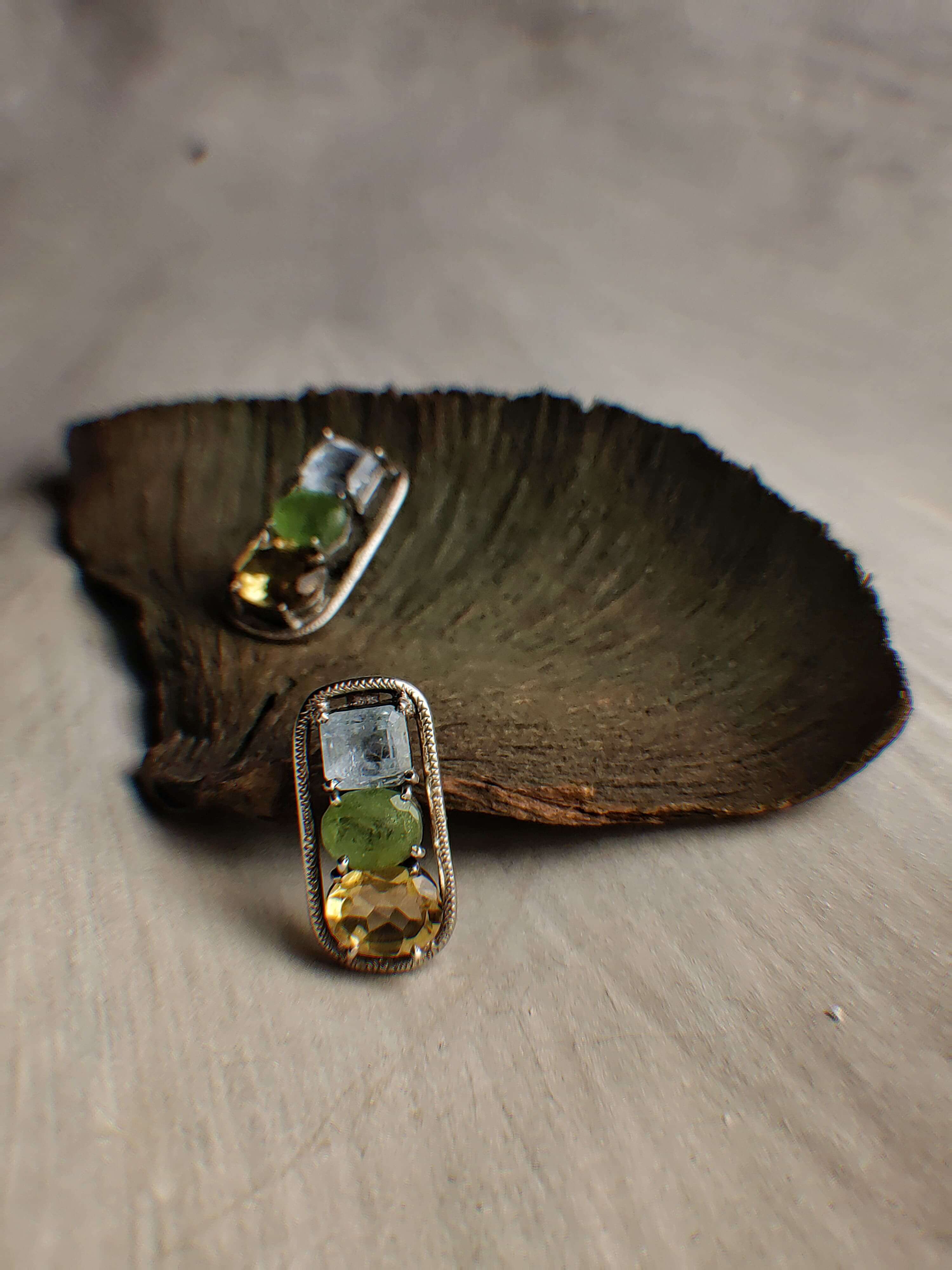 Hemlock: A handcrafted Earrings featuring Aquamarine Topaz Peridot and hues of Blue Green Yellow.