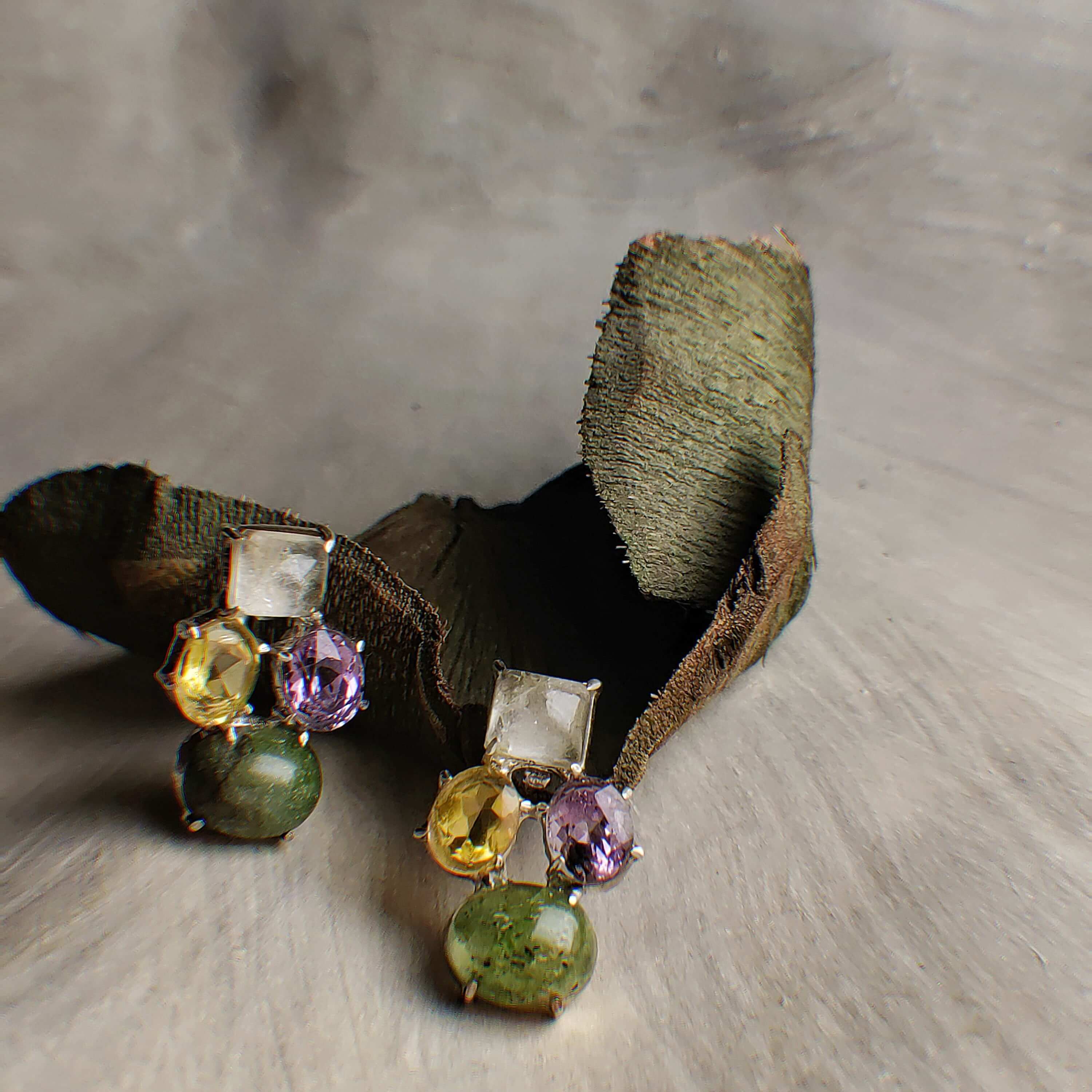 Monet's: A handcrafted Earrings featuring Quartz Peridot Citrine Amethyst and hues of Yellow Green Purple White.