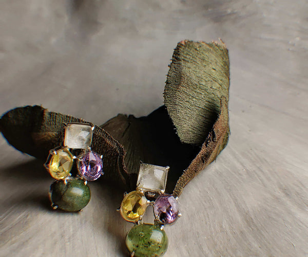 Monet's: A handcrafted Earrings featuring Quartz Peridot Citrine Amethyst and hues of Yellow Green Purple White.