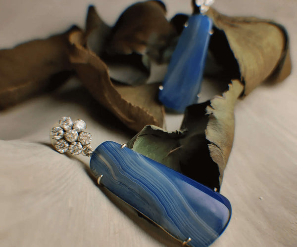 Blue wasp: A handcrafted Earrings featuring Agate  Zirconia and hues of Blue White.