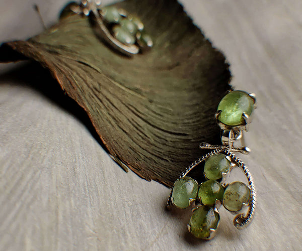 Grape seeds: A handcrafted Earrings featuring Peridot and hues of Green.