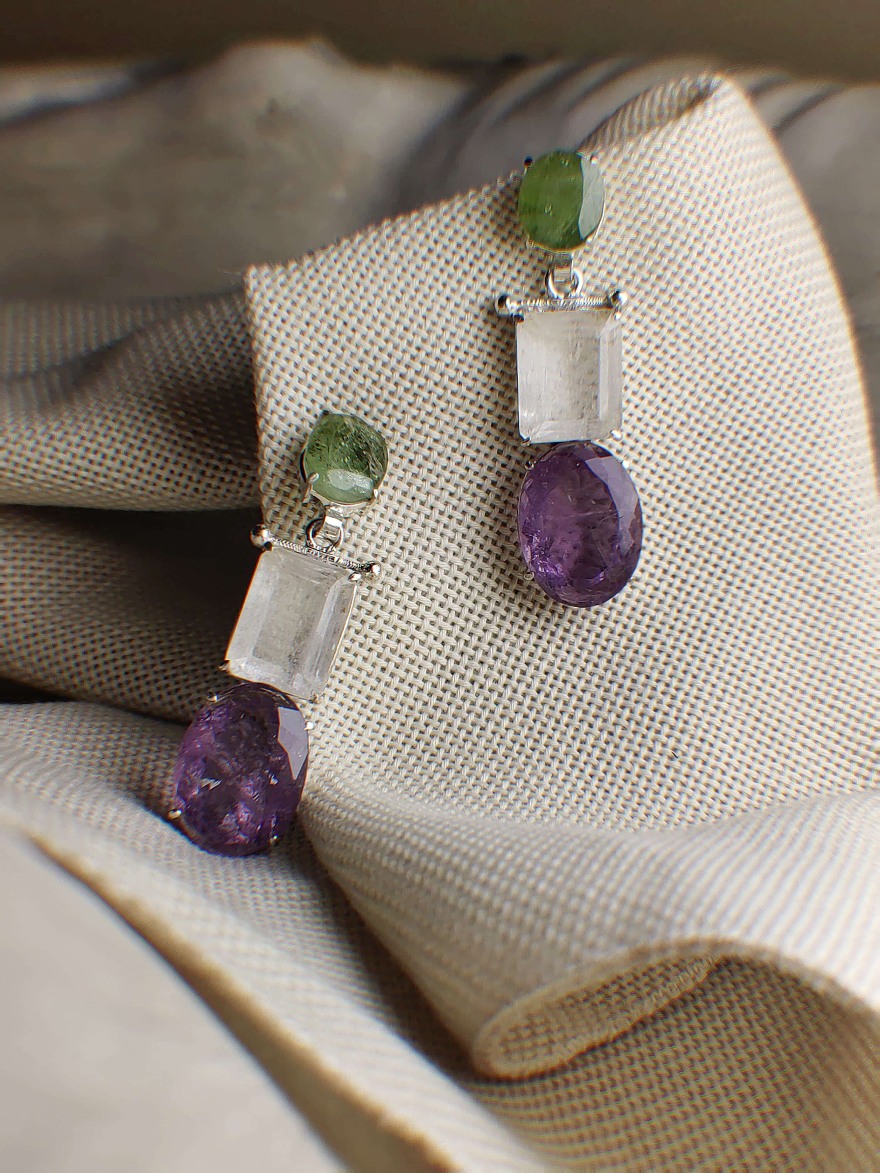 Zeenia: A handcrafted Earrings featuring Amethyst Quartz Peridot and hues of Green White Purple.