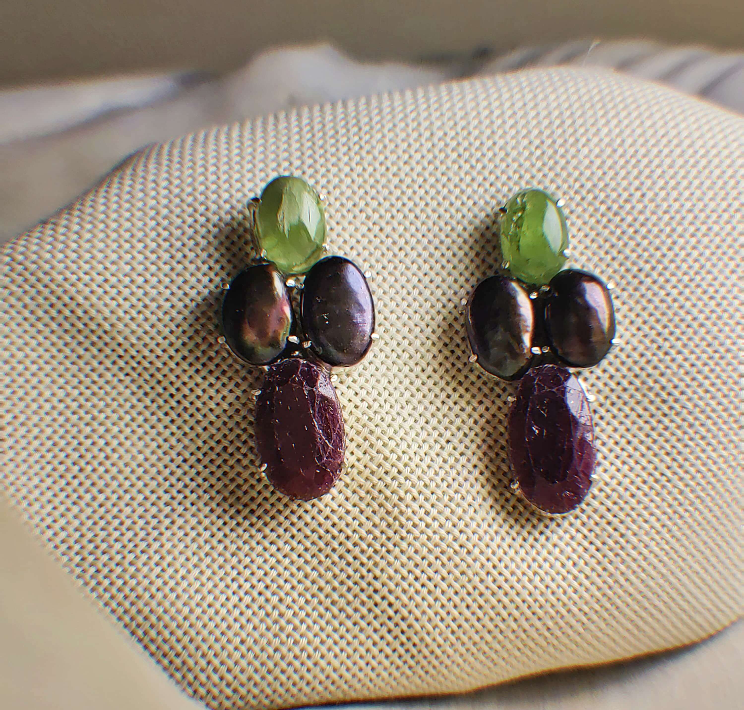 Four: A handcrafted Earrings featuring Pearl Peridot Ruby and hues of Red Green Grey.