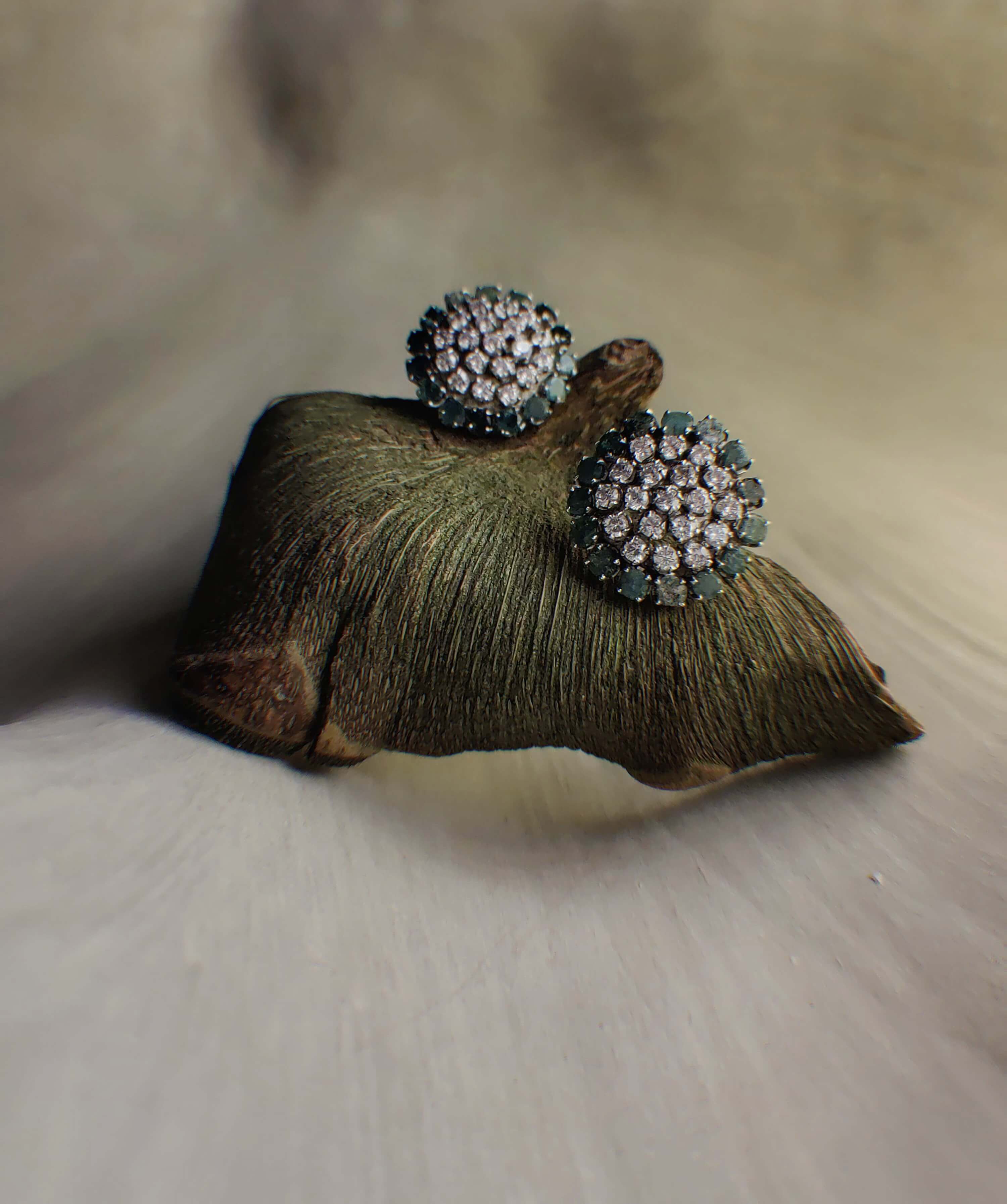 Sabah: A handcrafted Earrings featuring Emerald  Zirconia and hues of Green White.